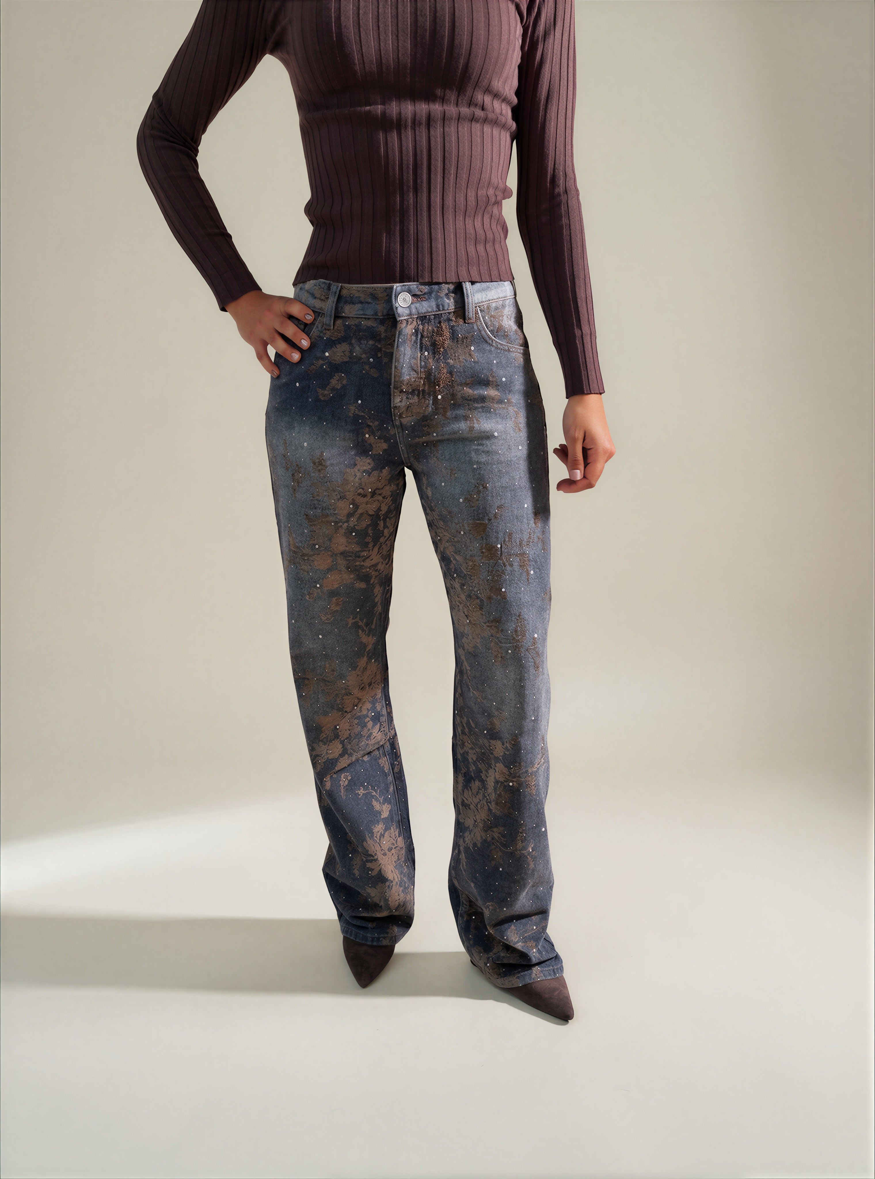 Jeans con stampa floreale ed effetti luce