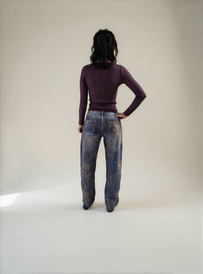 Jeans con stampa floreale ed effetti luce